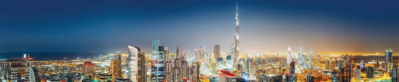 A panoramic view of an emerging Dubai neighbourhood with modern architecture and green spaces.